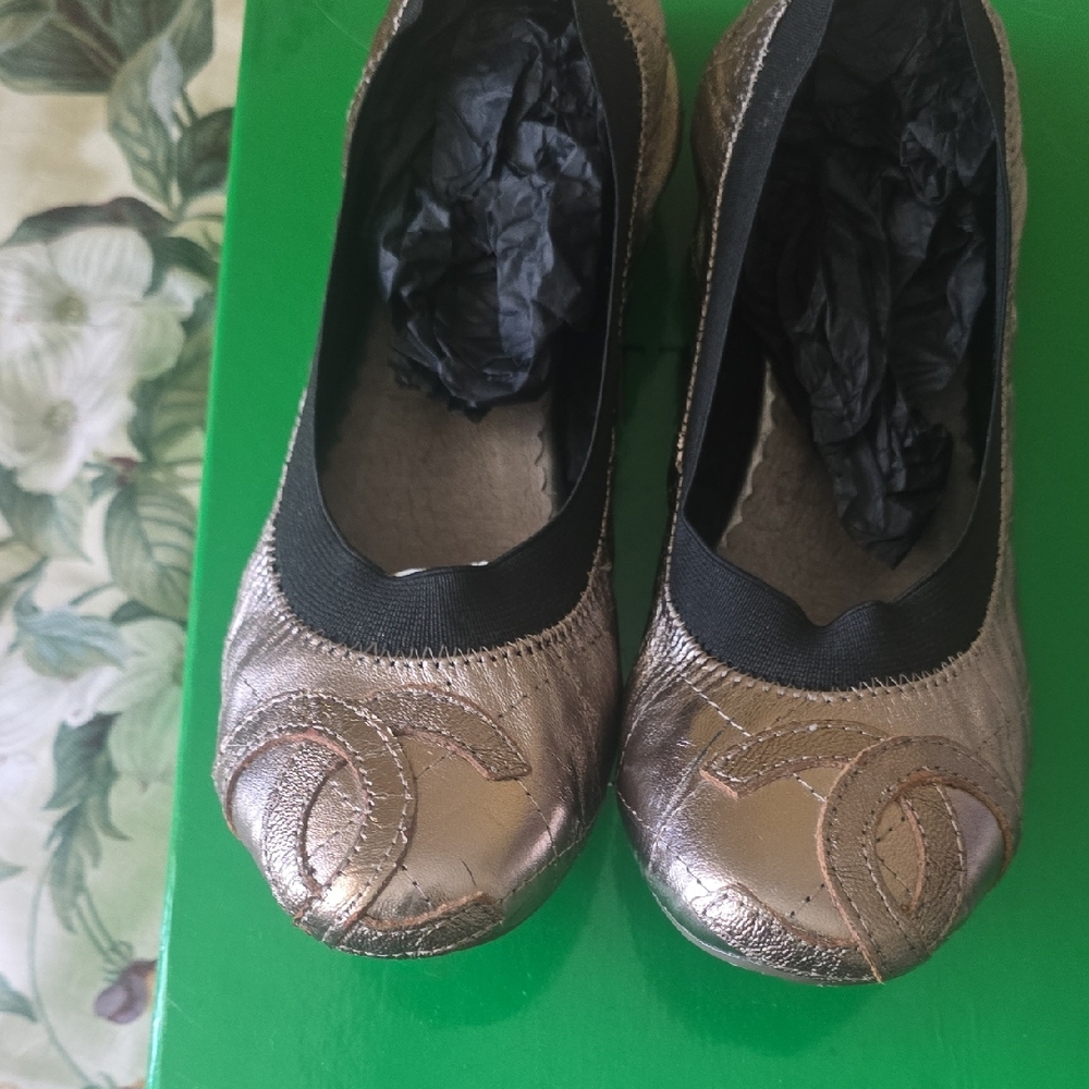 CHANEL Metallic Gold Flats with Black Trim